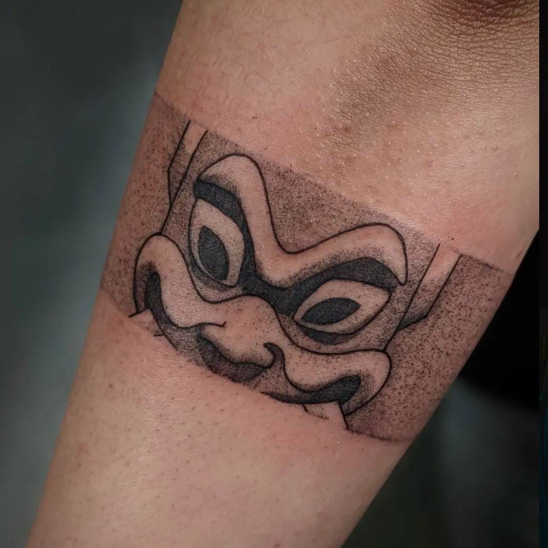 minimalist spirit mask tattoo