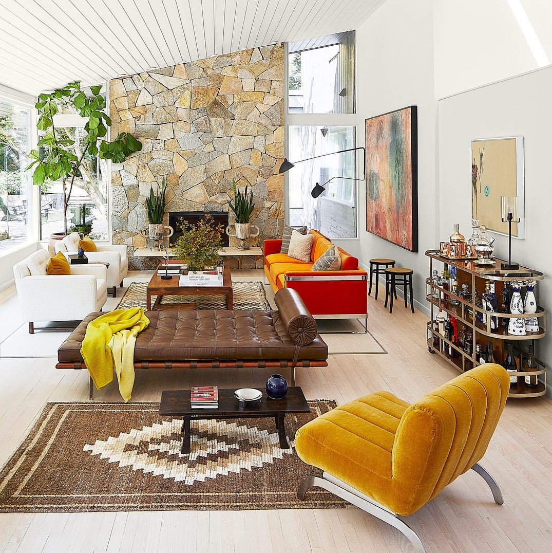 a small living room with a bar cart
