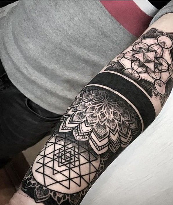 blackwork mandala tattoo