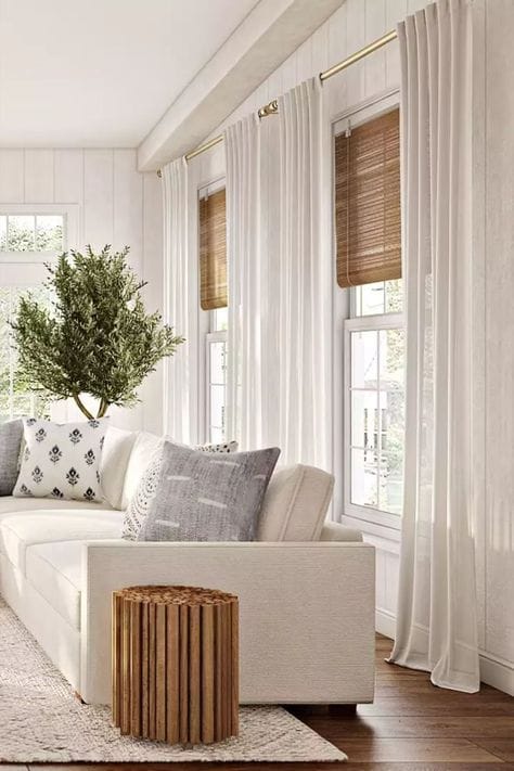 a stunning living room with sheer curtains