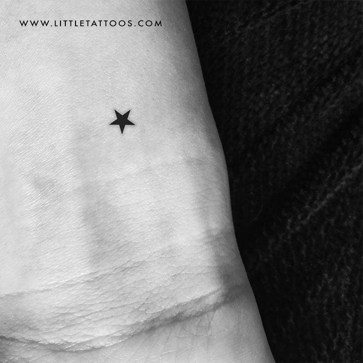 minimalist black star tattoo