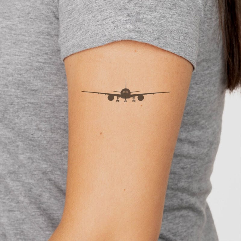 silhouette airplane tattoo