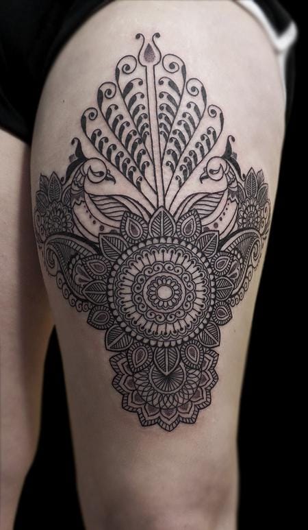 an Indian tattoo with a dot mandala