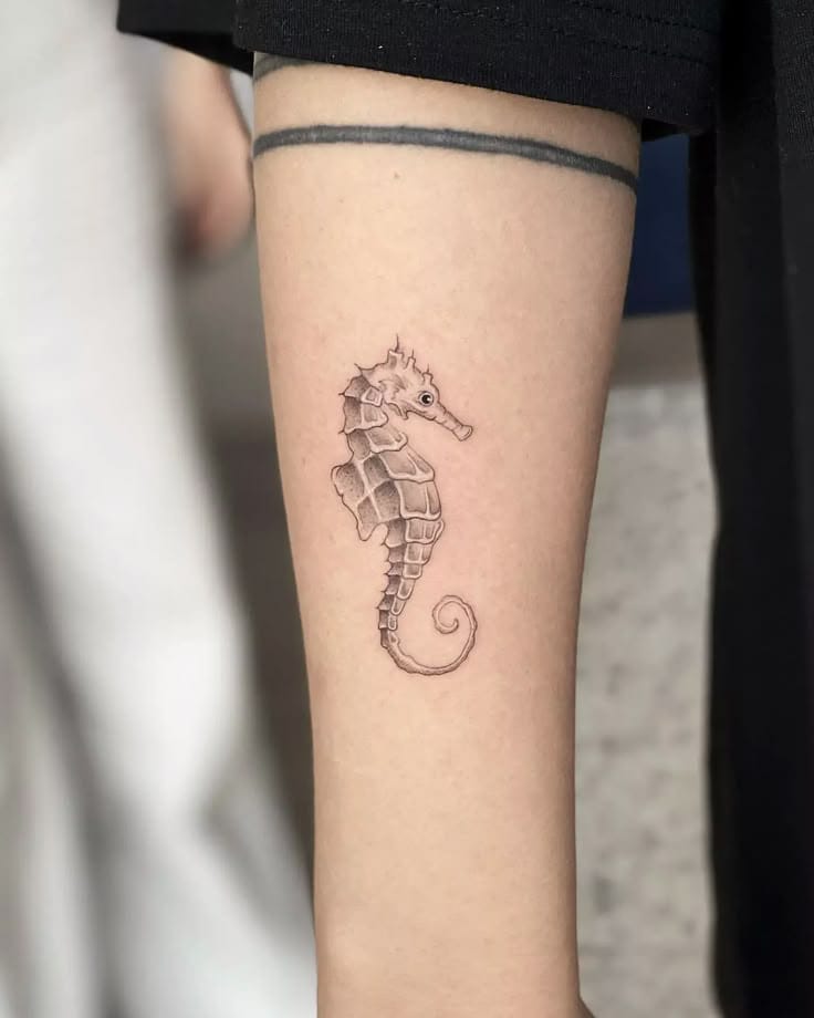 arm seahorse tattoo