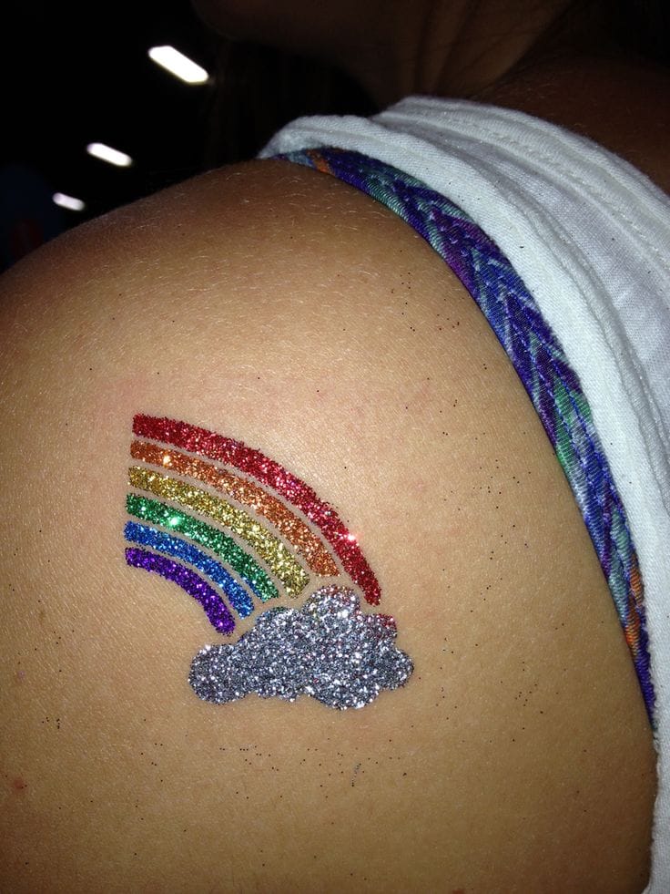 a dazzling glitter tattoo with a rainbow