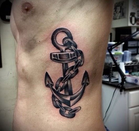 a cool ribs tattoo with anchor and rope