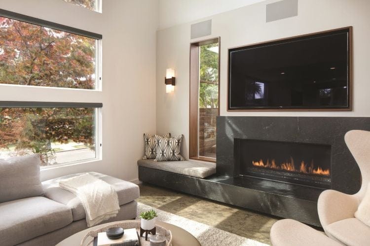 a small living room with wall sconces