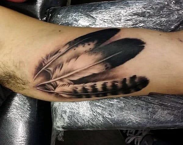 men's inner feather tattoo