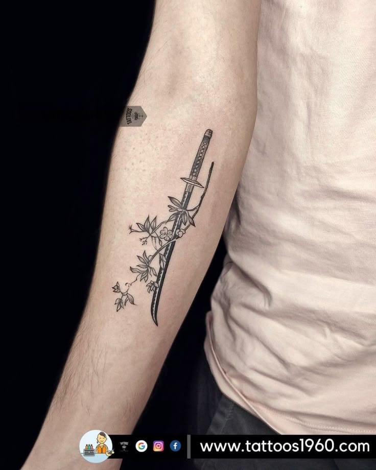 a small Japanese tattoo with a sword