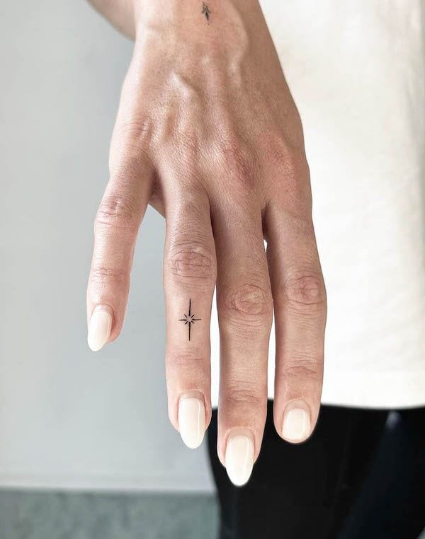 finger star tattoo