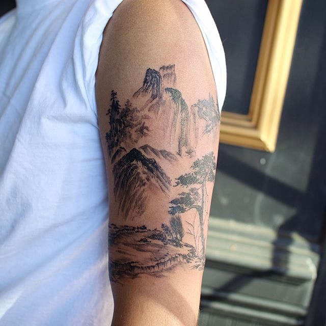 a small Japanese tattoo with a mountain