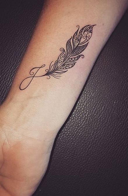feather embellished j tattoo