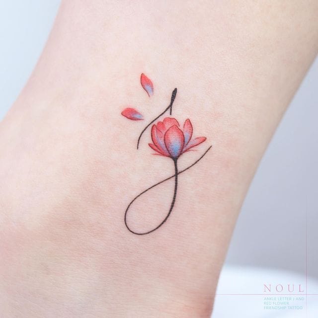 floral initial j tattoo