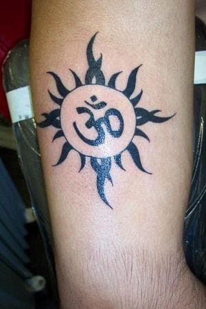 an Indian tattoo with sun symbol