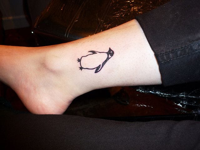 small ankle penguin tattoo