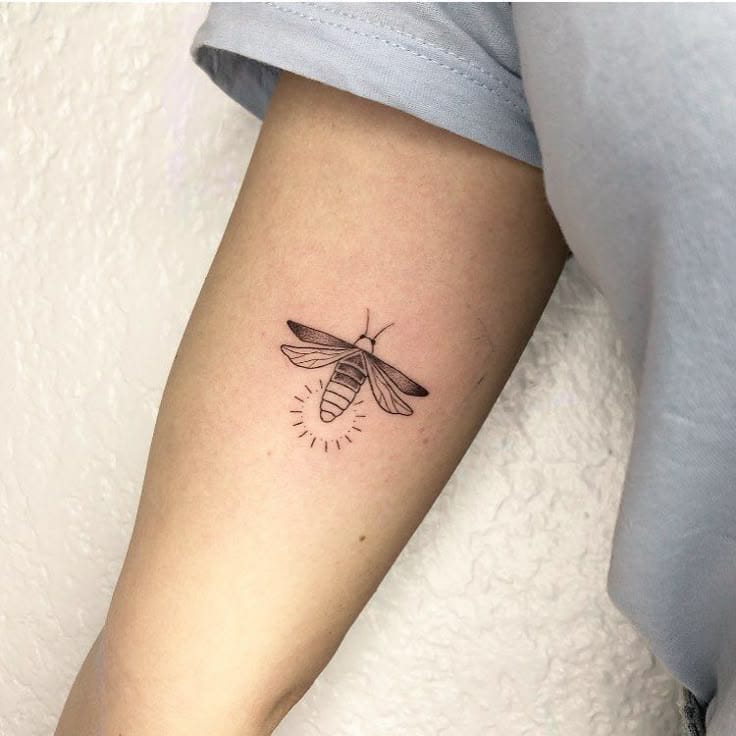 a minimalist firefly tattoo with line drawing