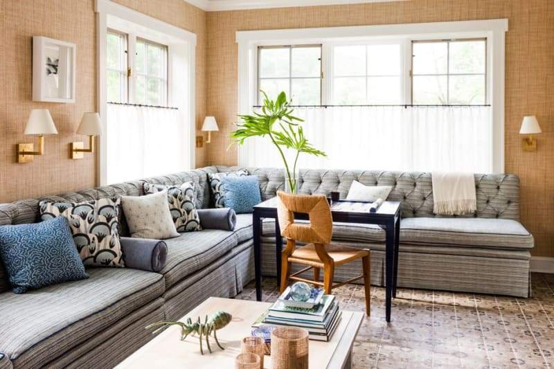 a bright living room with cafe curtains