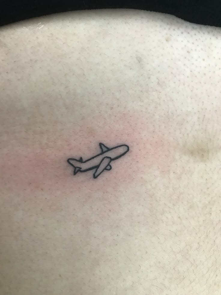 small airplane outline tattoo