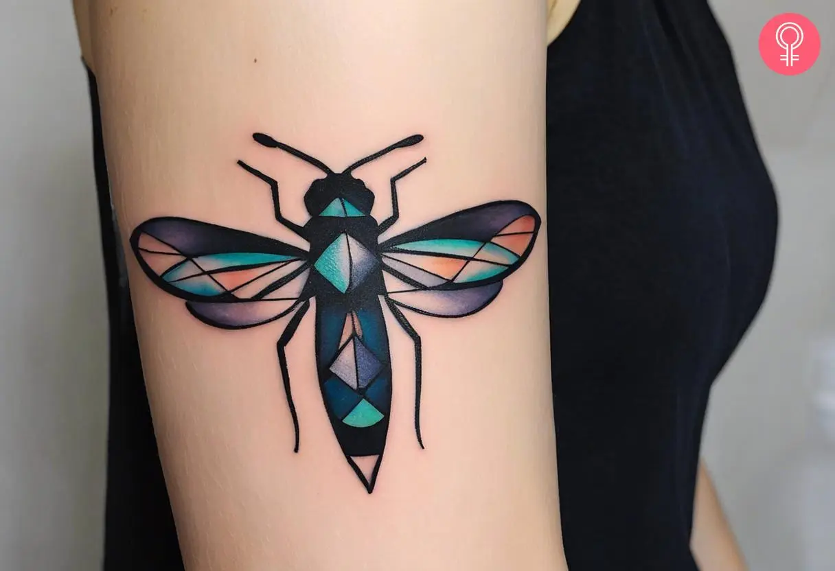 a geometric firefly tattoo with geometric shapes