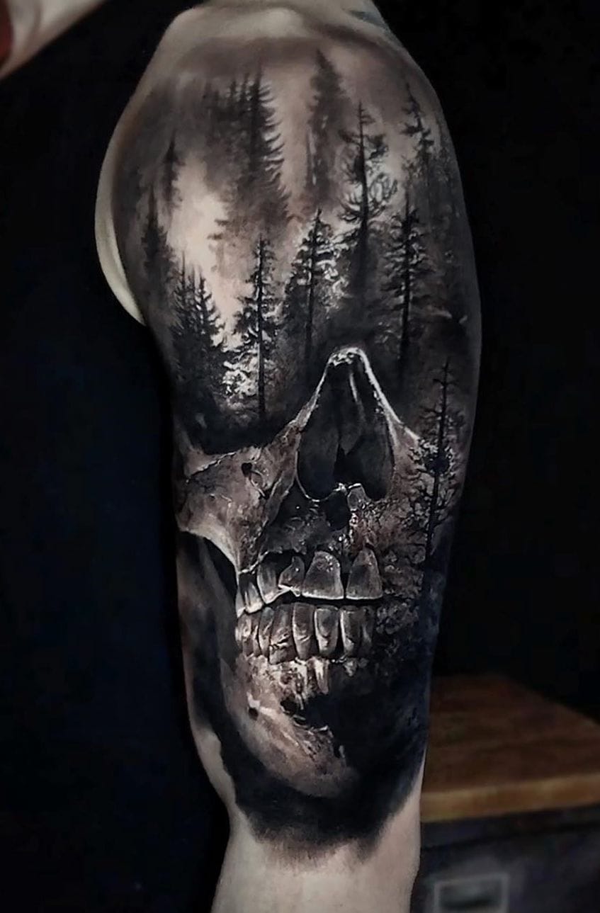 an upper arm tattoo with a skull