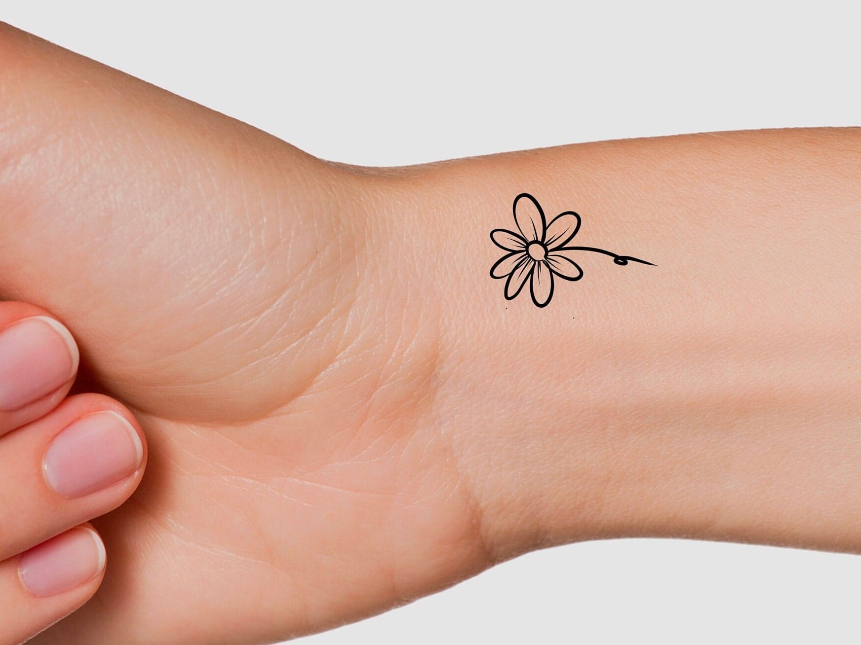 small daisy tattoo