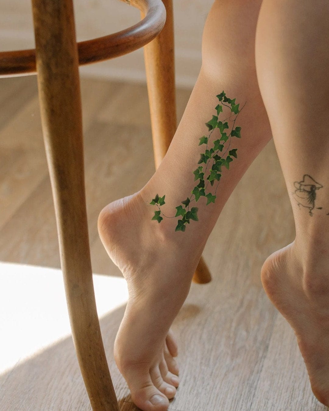 foot climbing ivy tattoo