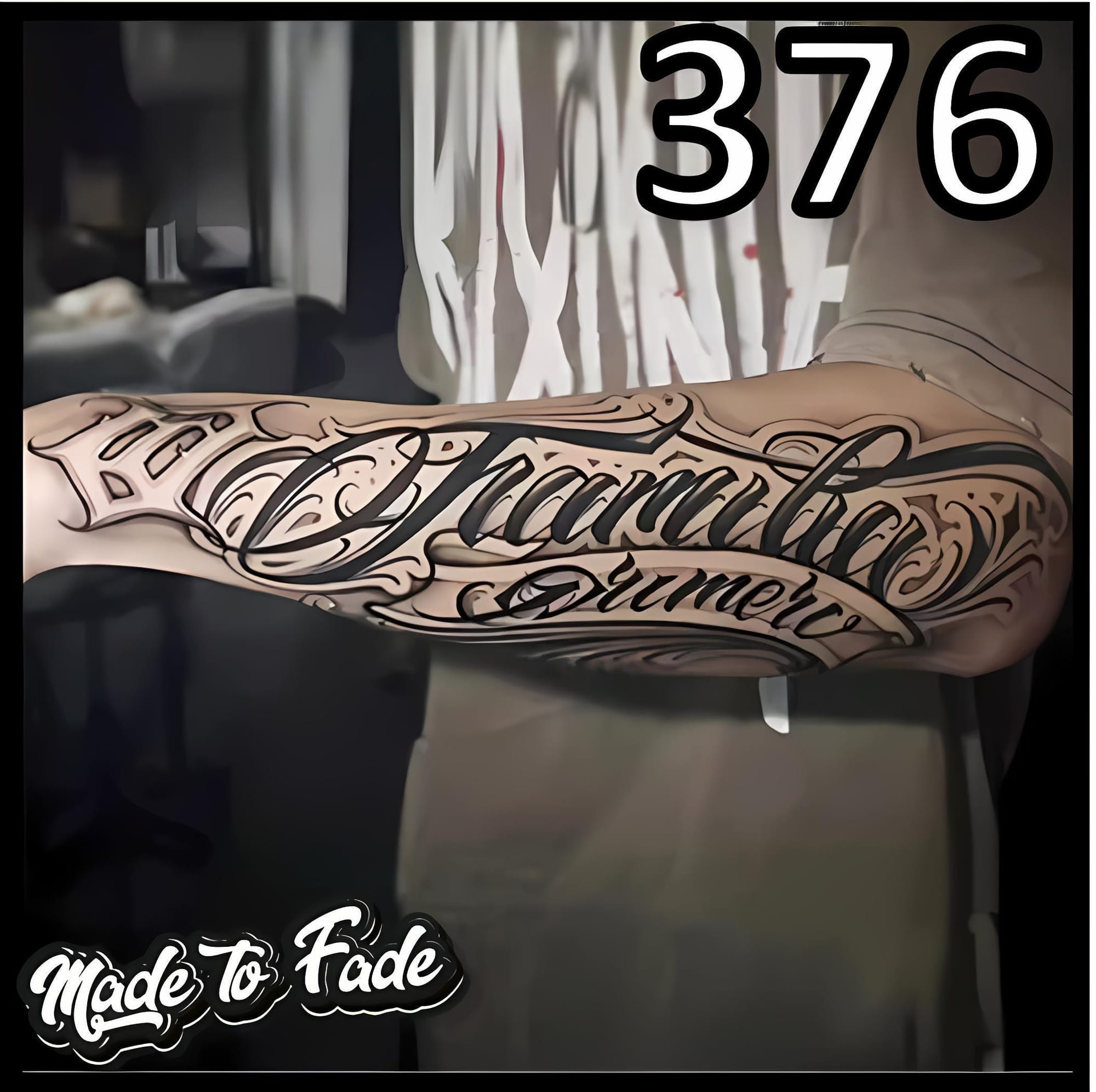 upper arm with script tattoo in elegant calligraphy font