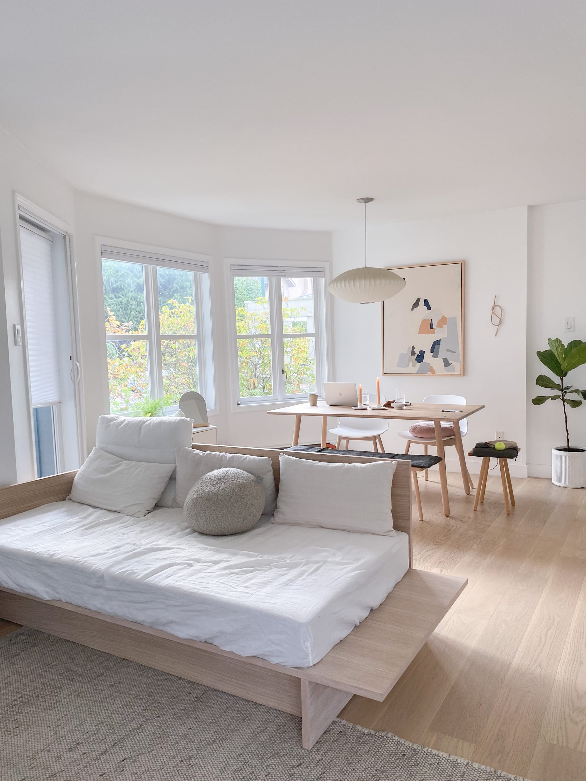 a small living room with a sofa bed