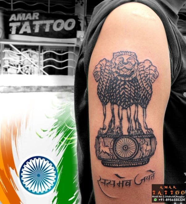 an Indian tattoo with an Ashoka Chakra