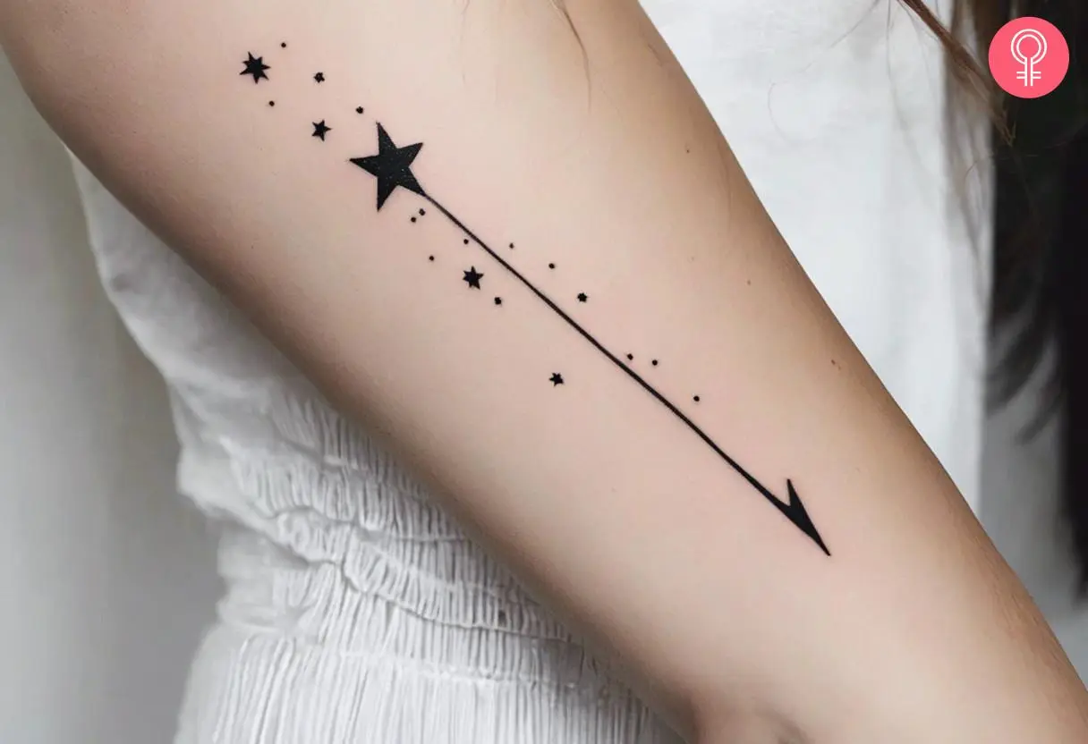 a beautiful shooting star tattoo with fine line detailing