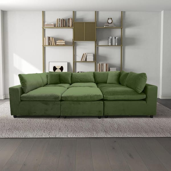 living room with moss green velvet modular sofa with customizable configurations