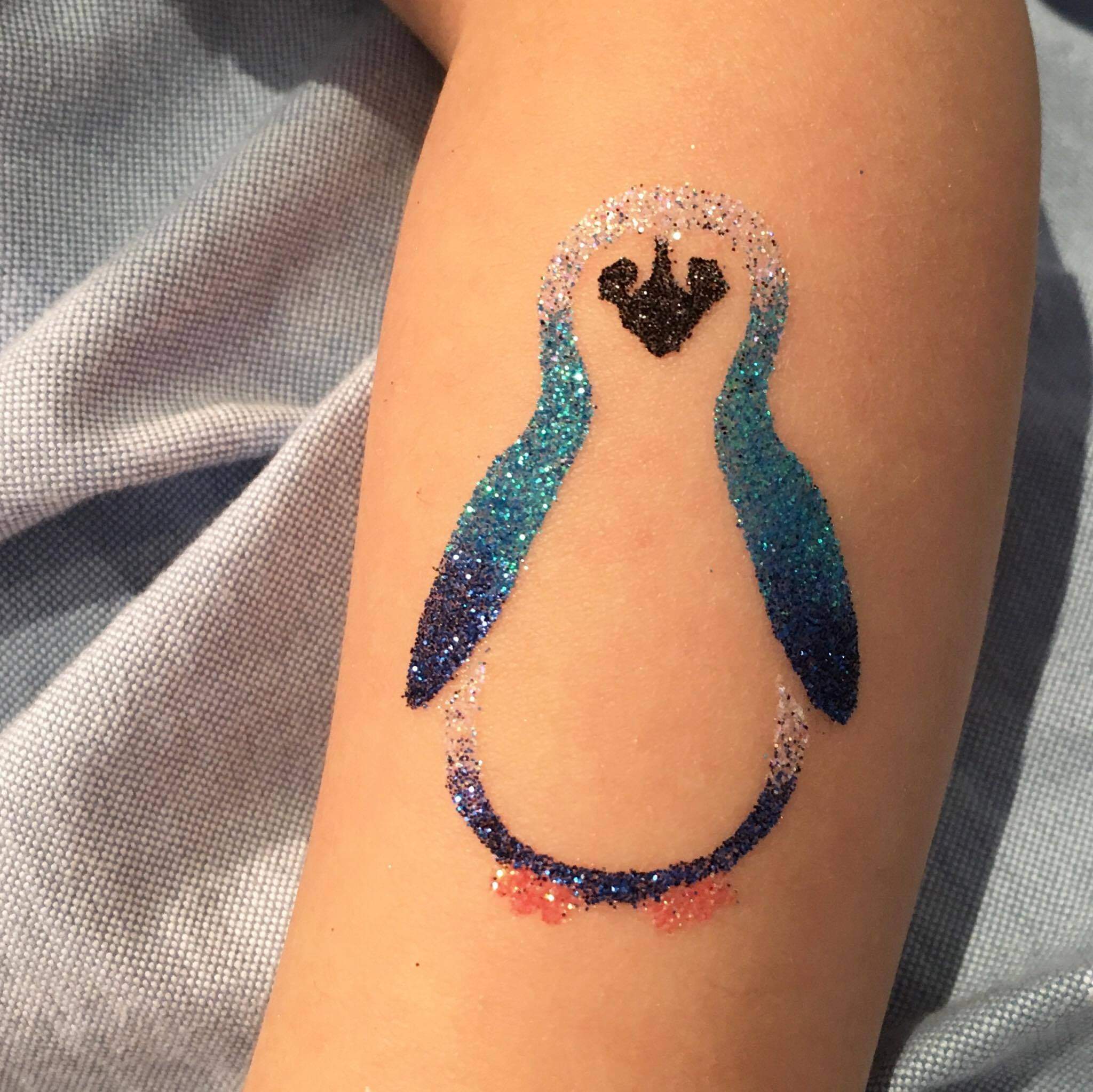 glittery shimmer penguin tattoo