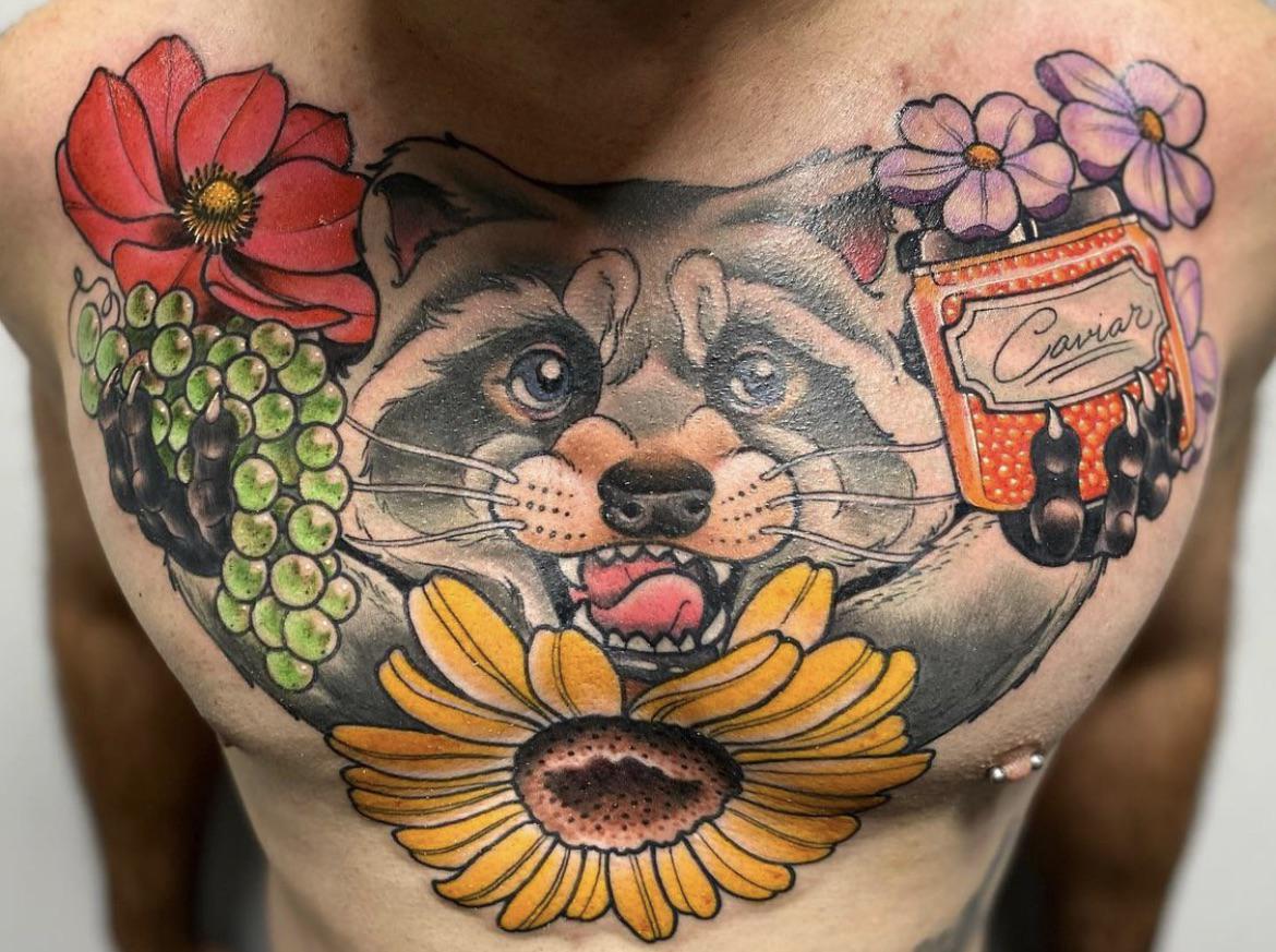 sternum raccoon tattoo