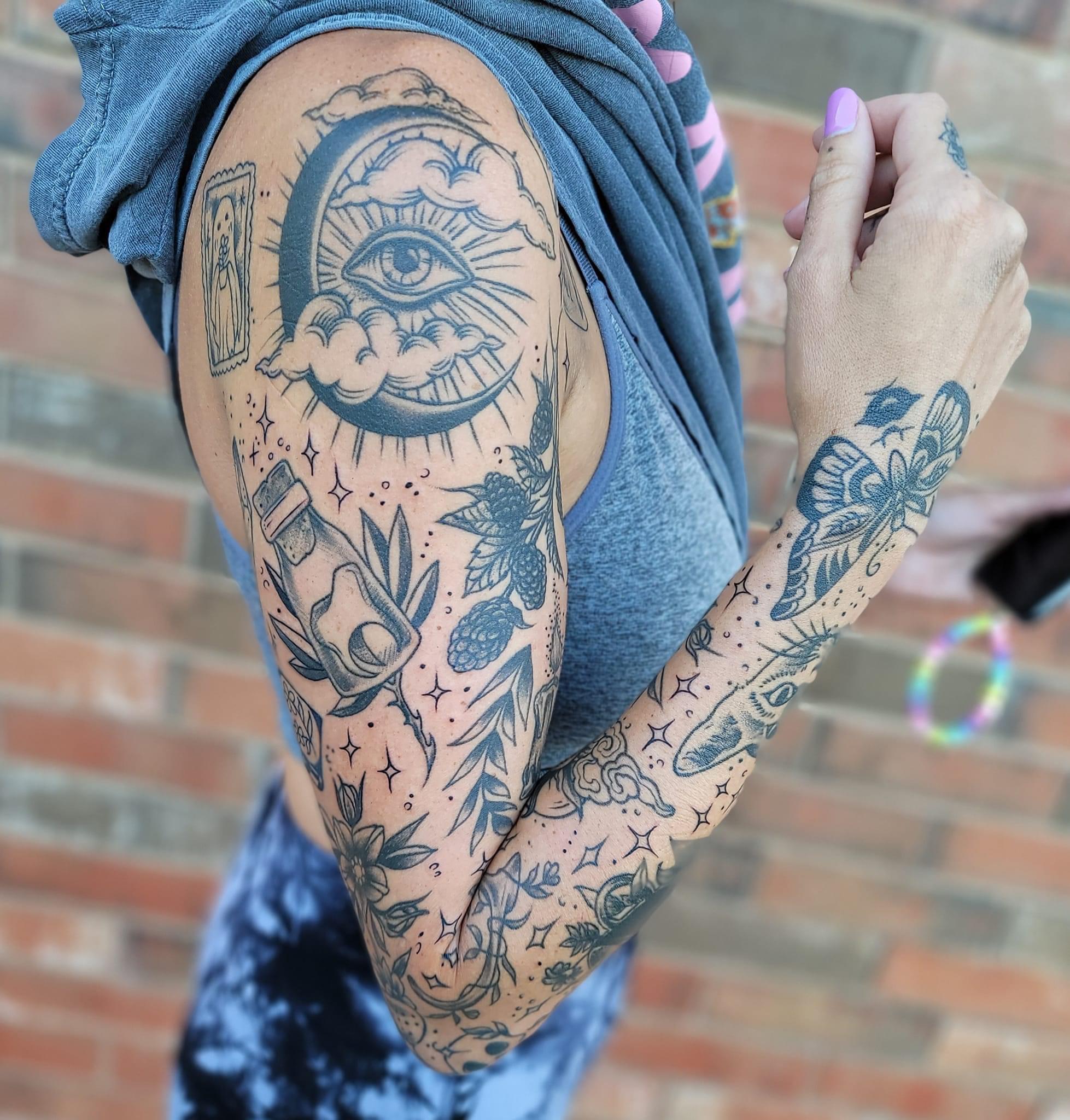 ornamental patchwork sleeve tattoo