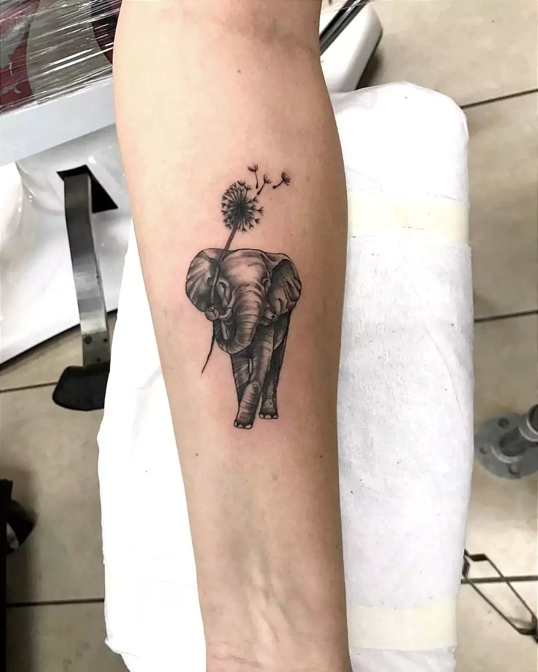 walking elephant tattoo