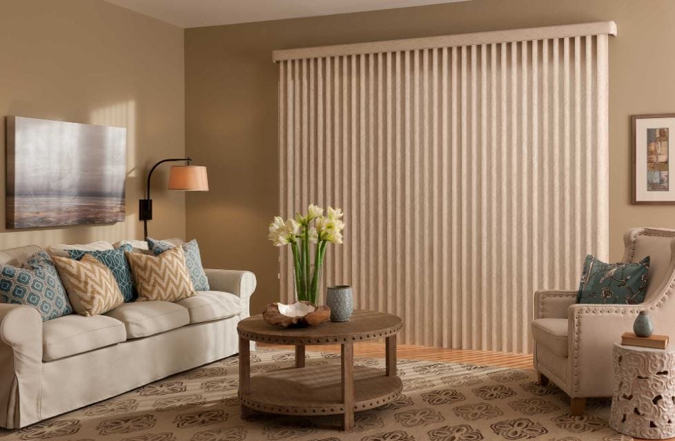 a living room with vertical blinds