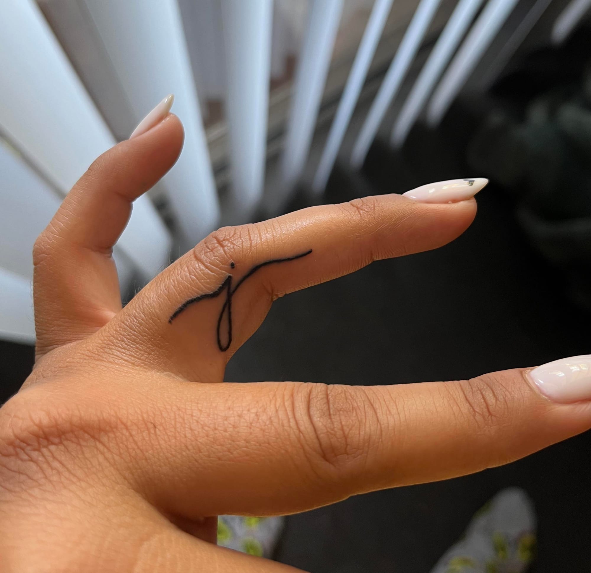 small finger j tattoo