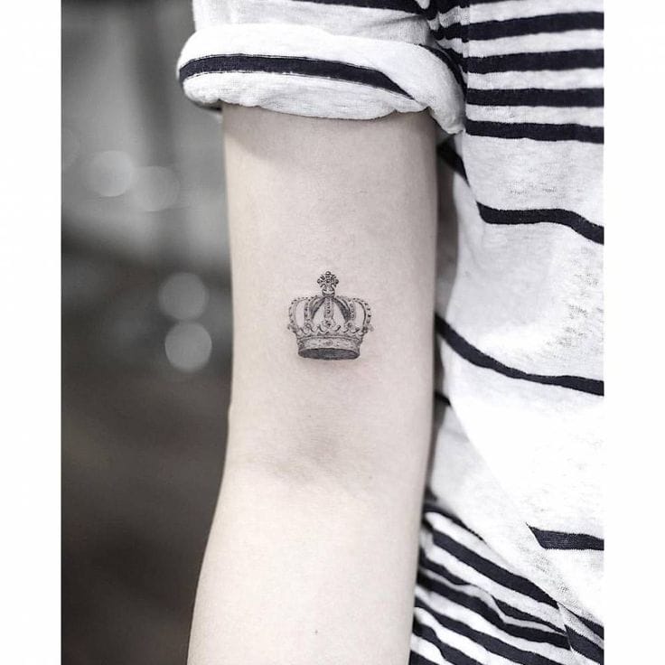 bicep crown tattoo