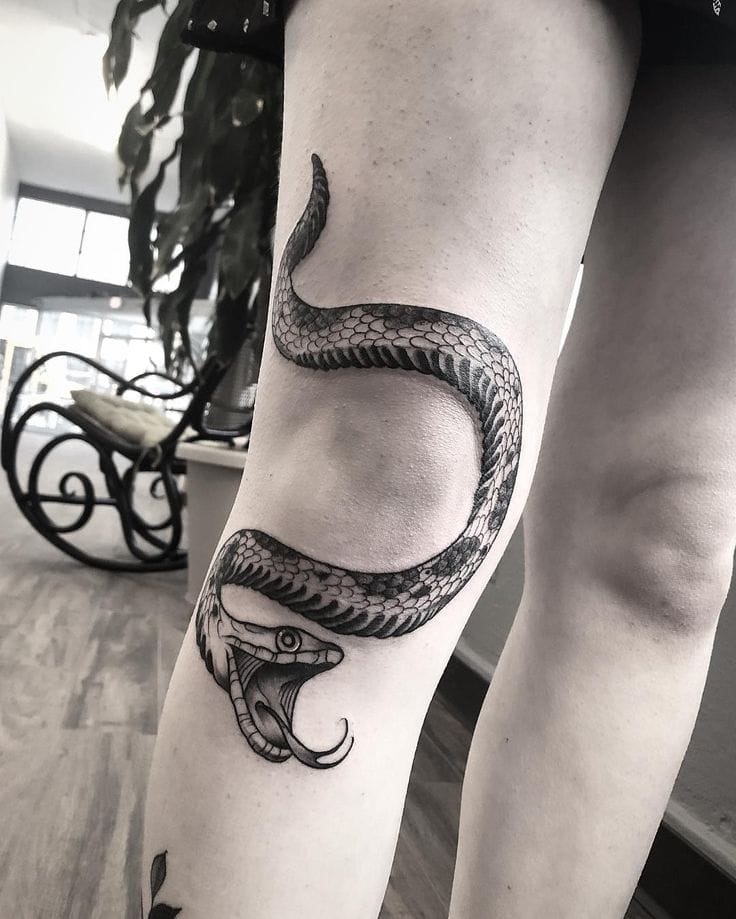 snake knee tattoo