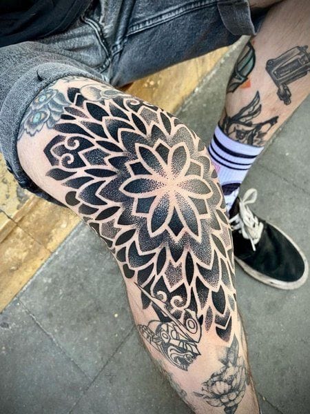 geometric flower knee tattoo