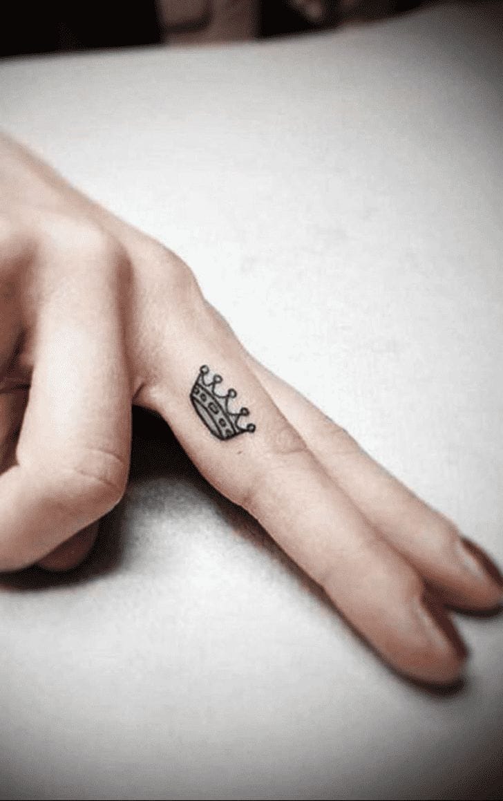 small finger crown tattoo