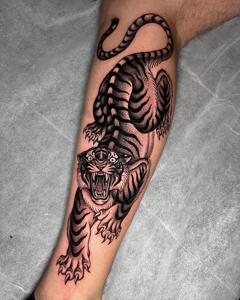 tiger on arm tattoo