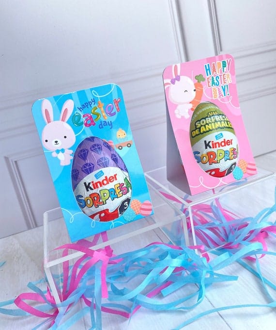 a colorful display with Kinder Surprise Eggs