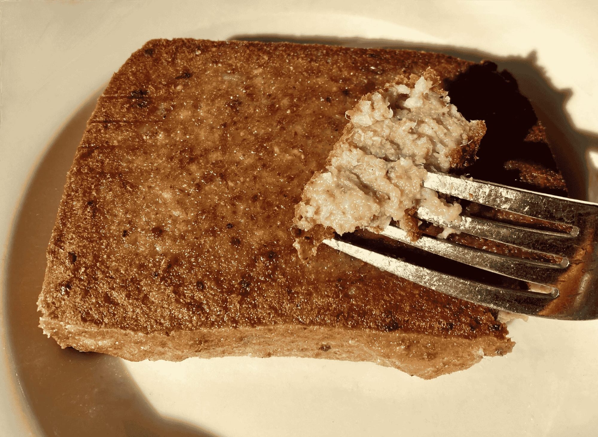 a cooked Delaware scrapple with a recipe card