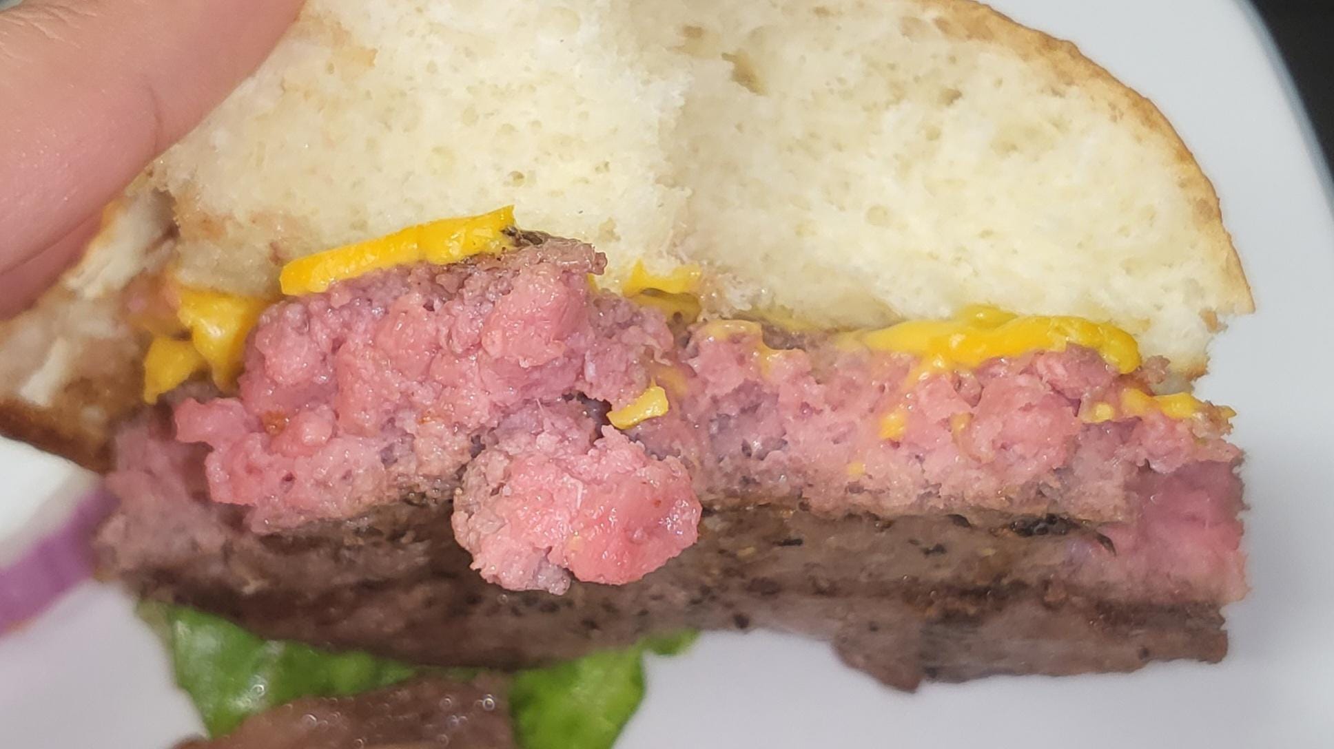 a rare burger with a pink center