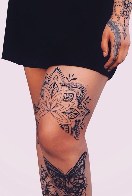 Mandala artistry meets feminine grace in this stunning thigh piece, where intricate lotus petals unfold across the skin like a blooming garden 🌸 The delicate linework and geometric patterns create a mesmerizing flow that perfectly complements the natural curves of the leg, while coordinating hand tattoos tie the entire look together with bohemian elegance.