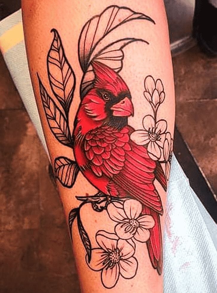 Vibrant scarlet feathers catch the eye in this stunning forearm piece, where a majestic cardinal perches among delicate cherry blossoms and flowing botanical elements. The artist's skillful use of bold red ink creates incredible depth and dimension, while the black linework adds elegant contrast that makes this nature-inspired design truly pop against the skin. 🌸