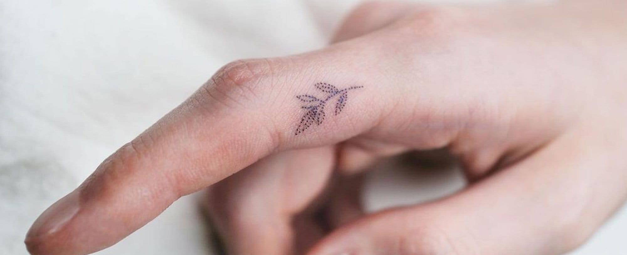 Delicate dotwork creates an ethereal arrow that seems to float across the knuckles, transforming a simple directional symbol into something almost mystical. The hand-poked technique gives this piece an organic, dreamy quality that feels both ancient and modern ✨ Perfect placement for those who want their intentions literally at their fingertips.