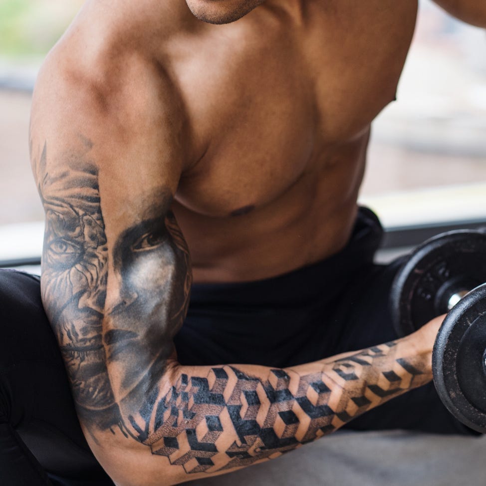 Geometric patterns cascade down this forearm like digital armor, creating a striking contrast against the realistic portrait work above. The seamless blend from photorealistic facial details into sharp, angular cube formations showcases masterful technical skill and creates a compelling visual narrative about the intersection of humanity and modern design. 🔳