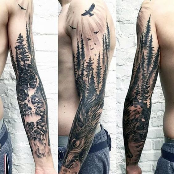 A masterful black and grey forest scene winds dramatically down this full sleeve, where towering evergreens emerge from misty depths while ravens take flight overhead 🌲 The artist's incredible attention to detail transforms the entire arm into a living wilderness landscape, with the tree bark texture flowing seamlessly into the natural curves of the limb. This nature-inspired masterpiece captures both the serenity and wild power of an untamed forest in stunning realistic detail.